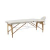 Tragbarer Beauty-Tisch von Sella: Dreiteilige Struktur aus hellem Holz, verstellbar über Spanner und ergonomisches Gesichtsloch